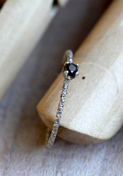 Black diamond solitaire ring