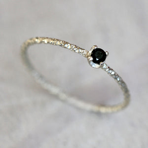 Black diamond solitaire ring