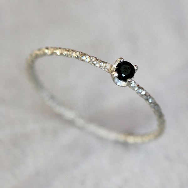 Black diamond solitaire ring