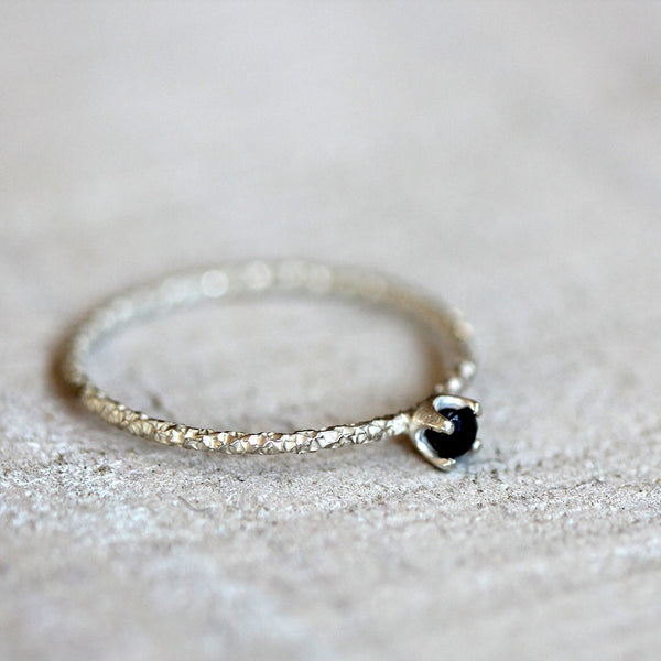 Black diamond solitaire ring