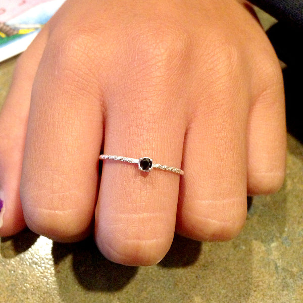 Black diamond solitaire ring